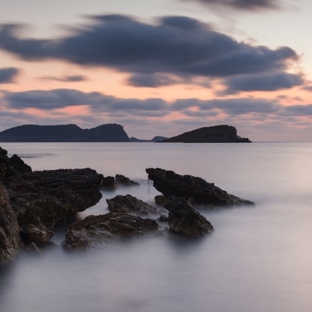 Dawn sunrise landscape over beautiful rocky coastline in Mediterranean Seaの写真素材
