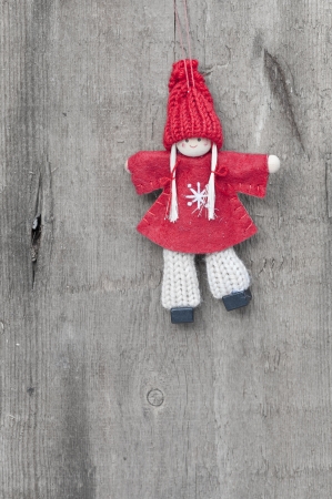 Christmas peg dolly ornament on rustic style grunge backgroundの写真素材