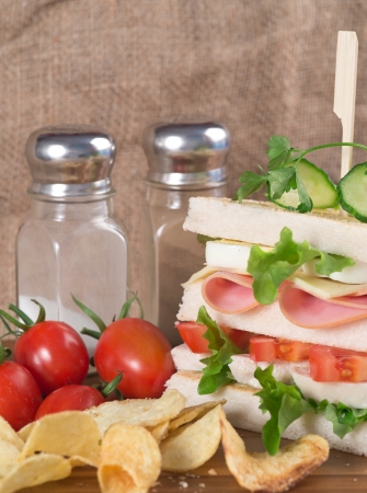 Rustic kitchen setting for fresh club sandwichの写真素材