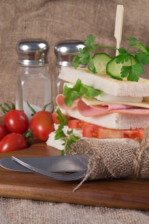 Rustic kitchen setting for fresh club sandwichの写真素材