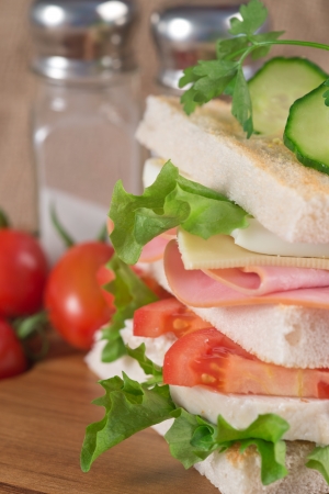 Rustic kitchen setting for fresh club sandwichの写真素材