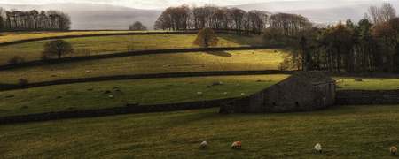 Panorama landscape traditional stone barn in Autumnal countryside の写真素材