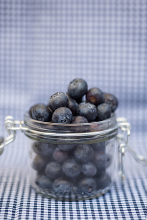 Fresh fruit blueberry in glass storage jarの写真素材