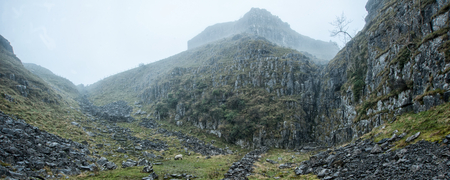 Panorama landscape view along foggy mountain pass in Autumn