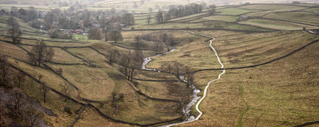 Panorama landscape stream running through bottom of valleyの写真素材