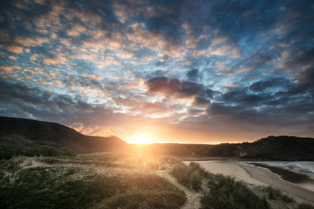Beautiful Summer morning landscape over yellow sandy beachの写真素材