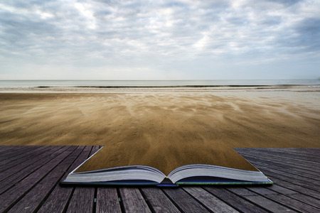Footprints on empty beach Summer landscape conceptual book imageの写真素材