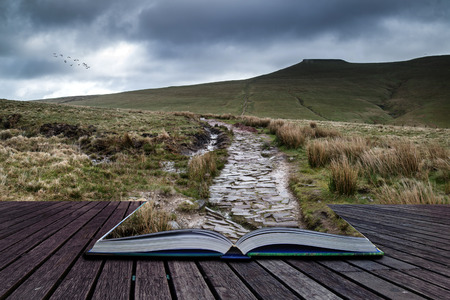 Beautiful landscape of Brecon Beacons National Park with dramatic sky conceptual book imageの写真素材