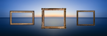 Beautiful long exposure seascape image of calm ocean at sunsetの写真素材