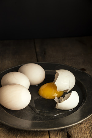Fresh duck eggs in moody vintage style natural lighting set upの写真素材