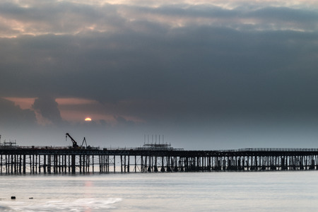 Sunrise landscape over pier under construction and developmentの写真素材