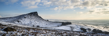Stunning Winter panorama landscape snow covered countryside with beautiful sky and cloudsの写真素材