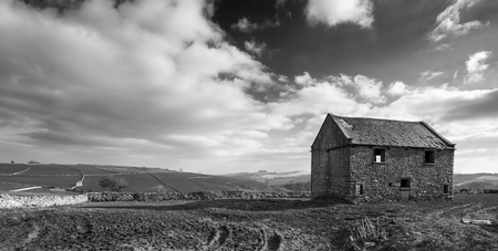 Beautiful landscape image of Peak District on bright sunny Spring dayの写真素材