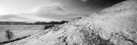 Stunning Winter panorama landscape snow covered countryside in black and whiteの写真素材
