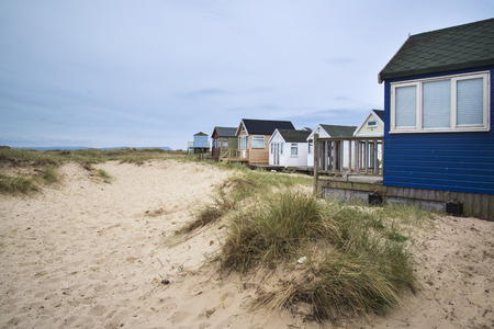 Beach huts on sand dunes and beach landscapeの写真素材