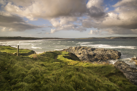Stunning sunrise landscape of Godrevy on Cornwall coastline in England