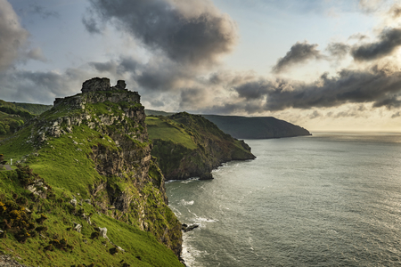 Beautiful sunset landscape image of Valley of The Rocks in Devon Englandの写真素材
