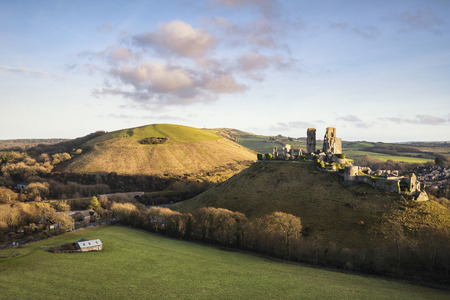 Medieval castle ruins in Autumn landscape at duskの写真素材