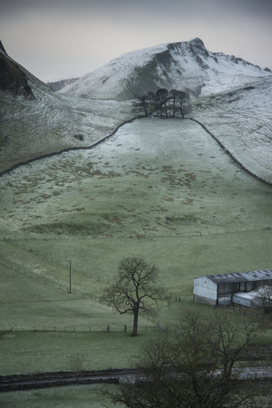 Beautiful Winter landscape image of Chrome Hill and Parkhouse Hill in Peak District Englandの写真素材