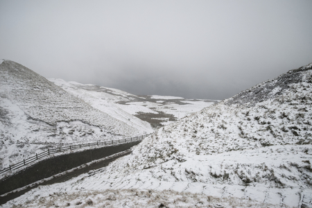 Stunning Winter landscape image around Mam Tor countryside in Peak District England