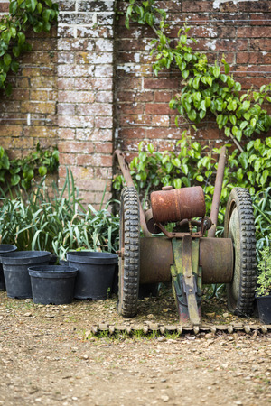 Beautiful vintage potting shed exterior detail in English countryside gardenの写真素材