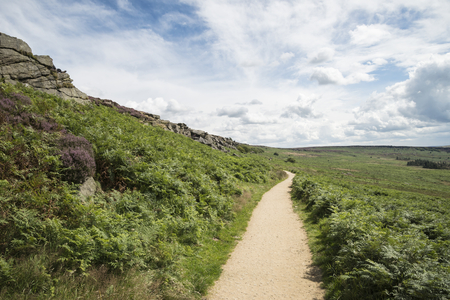 Beautiful landscape image of Burbage Edge and Rocks in Summer in Peak District England