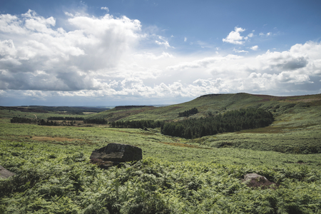 Beautiful landscape image of Burbage Edge and Rocks in Summer in Peak District Englandの写真素材