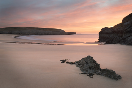 Stunning sunrise landsdcape of idyllic Broadhaven Bay beach on Pembrokeshire Coast in Wales