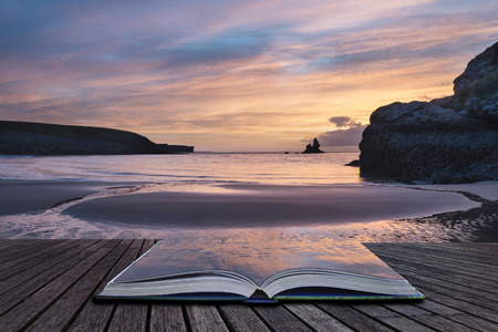 Stunning sunrise landsdcape of idyllic Broadhaven Bay beach on Pembrokeshire Coast in Wales in pages of imaginary story bookの写真素材