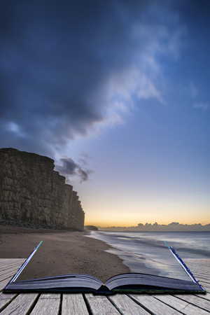 Creative book image of Beautiful long exposure sunrise landscape image of West Bay in Dorset Englandの写真素材