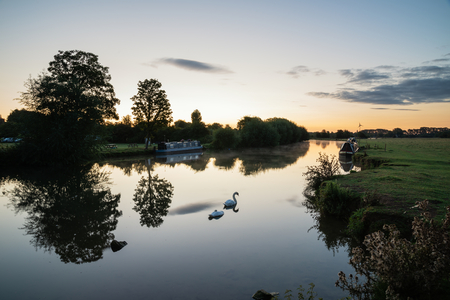 Beautiful sunrise landscape image of River Thames at Lechlade-on-Thames in English Cotswolds...