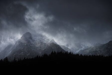 Stunning moody dramatic Winter landscape mountain image of snowcapped Y Garn in Snowdoniaの写真素材