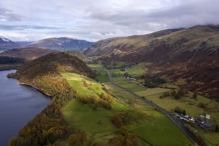 Beautiful aerial drone landscape image of glorious Autumn Fall sun over Thirlmere in Lake Districtの写真素材