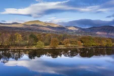 Stunning aerial drone landscape images over Coniston Water at sunrise on beautiful Autumn Fall morningの素材 [FY310137749120]