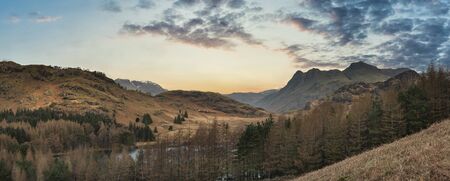 Epic drone landscape image of Blea Tarn in Lake District during Autumn Fall sunriseの写真素材