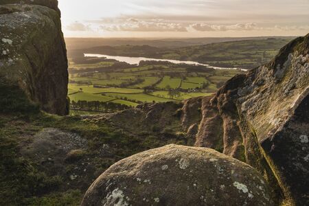 Stunning Peak District Winter landscape of view from top of Hen Cloud over countryside and towards Tittesworth Reservoirの写真素材