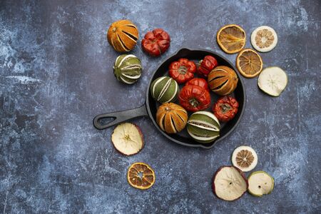 Flat lay image of dried seasonal Winter fruit on textured rough backgroundの写真素材