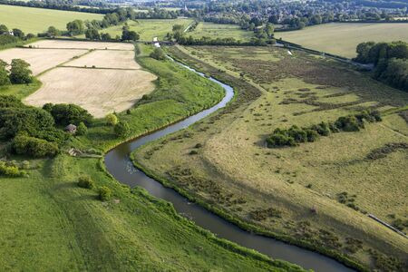 Stunning drone landscape image over lush green Summer English countryside during late afternoon lightの写真素材