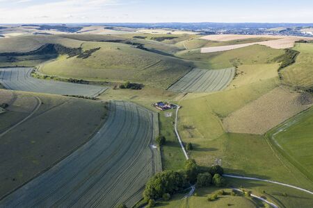 Beautiful drone landscape image of English countryside during late afternoon sunset Summer light