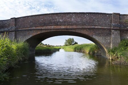 Stunning drone landscape image over lush green Summer English countryside during late afternoon lightの写真素材