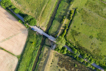 Stunning drone landscape image over lush green Summer English countryside during late afternoon lightの写真素材