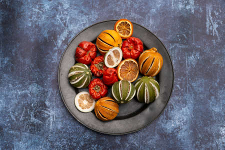 Flat lay image of dried seasonal Winter fruit on textured rough backgroundの写真素材