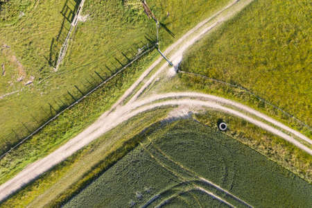 Beautiful high flying drone landscape image of rolling hills in English countryside with lovely warm lightの写真素材