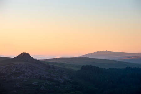 Absolutely stunning landscape image of Dartmoor in England showing Leather Tor and Kings Tor in epic...