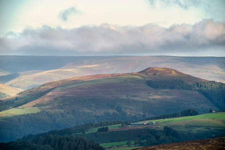 Stunning Peak District National Park during late Summer morning with stunning light across the hills