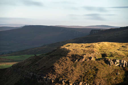 Stunning Peak District National Park during late Summer morning with stunning light across the hills