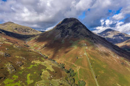 Stunning high point of view from flying drone over Lake District landscape in late Summer, in Wast...