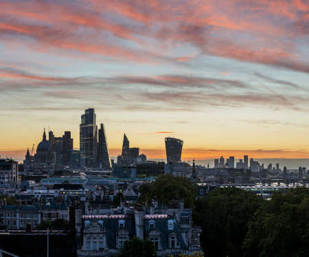 Epic landscape cityscape skyline image of London in England during colorful Autumn Fall sunriseの写真素材