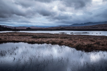 Epic landscape image of Loch Ba on Rannoch Moor in Scottish Highlands on a Winter morningの写真素材