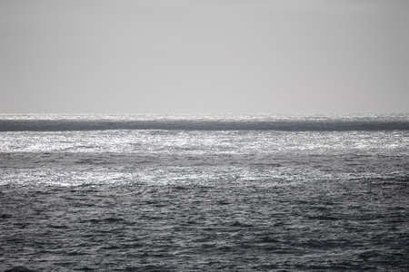 Beautiful fine art landscape image of view from Hartland Quay in Devon England durinbg moody Spring sunsetの写真素材